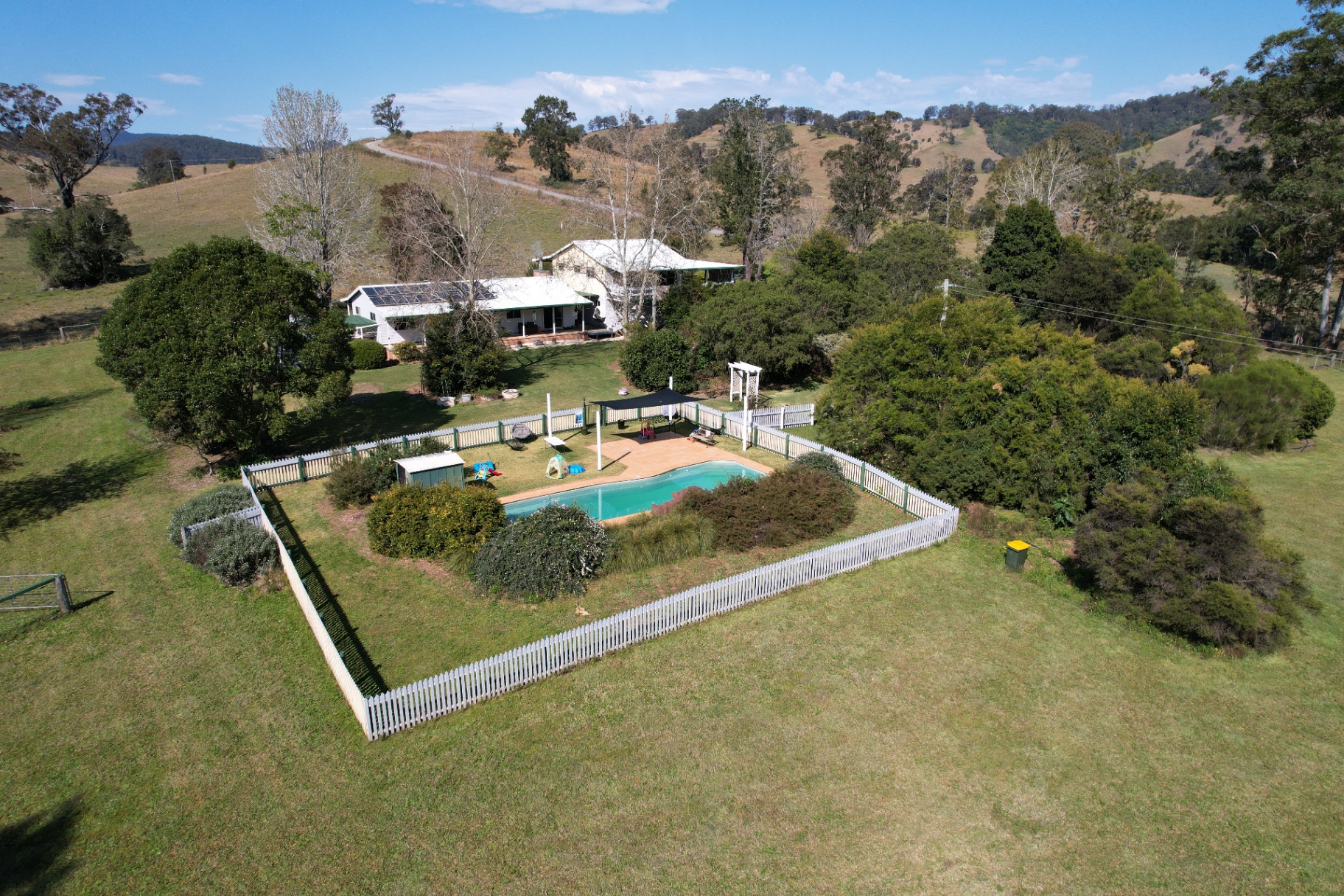 Aerial of the homestead with garden and rolling hills beyond